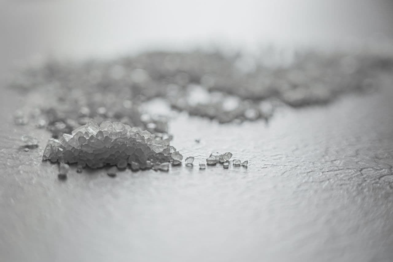 Close-up texture of high-purity white mineral powder representing raw clay and feldspars